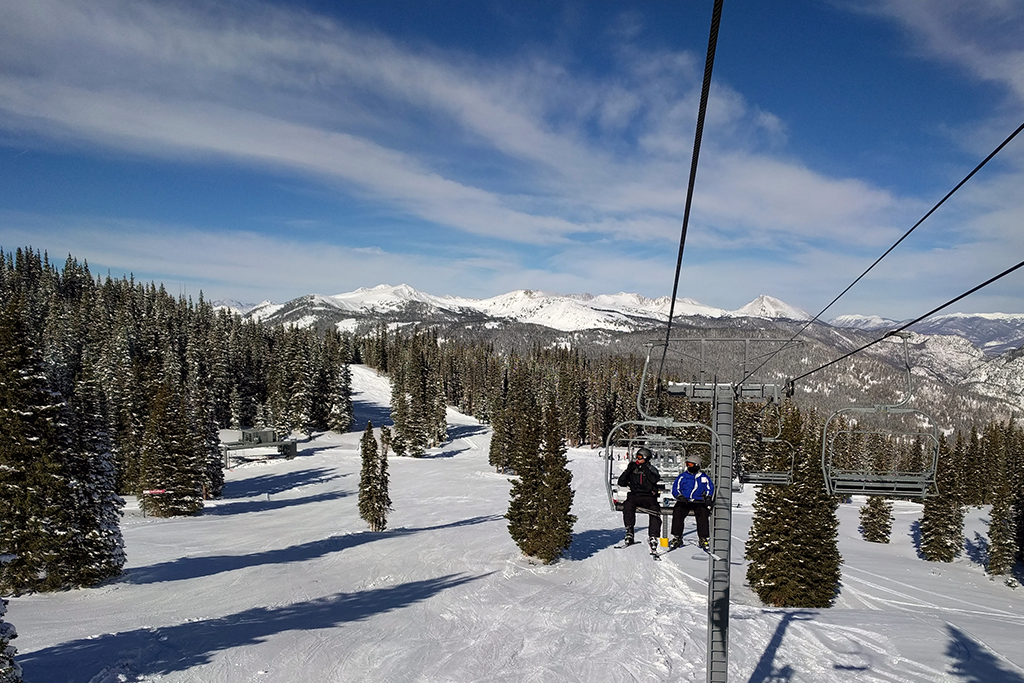 Two people on a ski lift