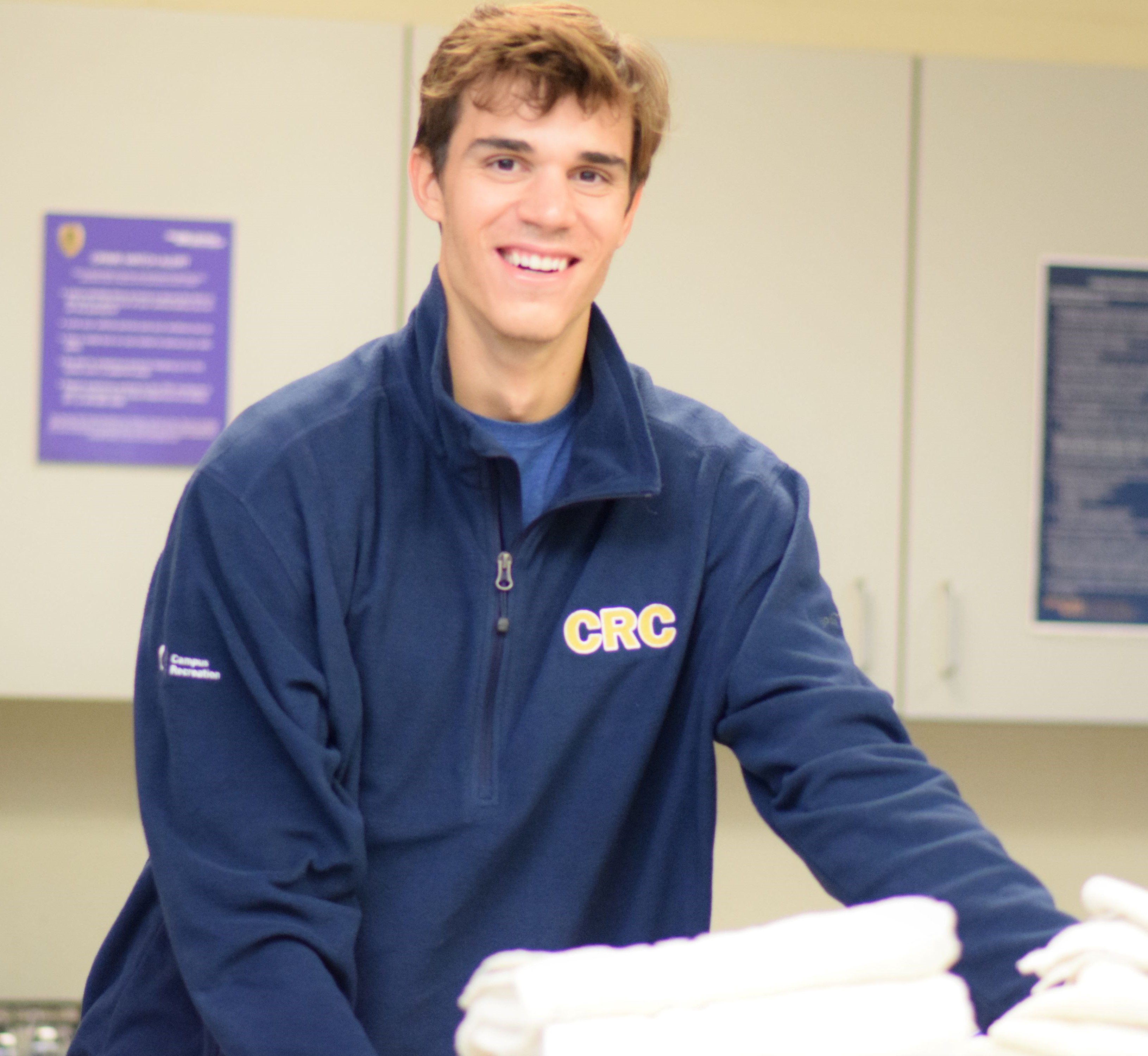 Student employee working at equipment desk