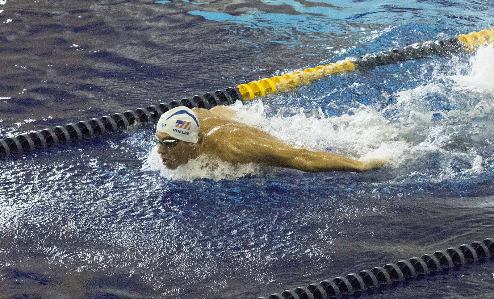 Michael Phelps swims at McAuley Aquatic Center during an open training session on July 30, 2016.