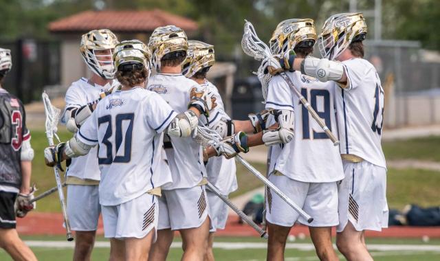 Lacrosse team celebrating.