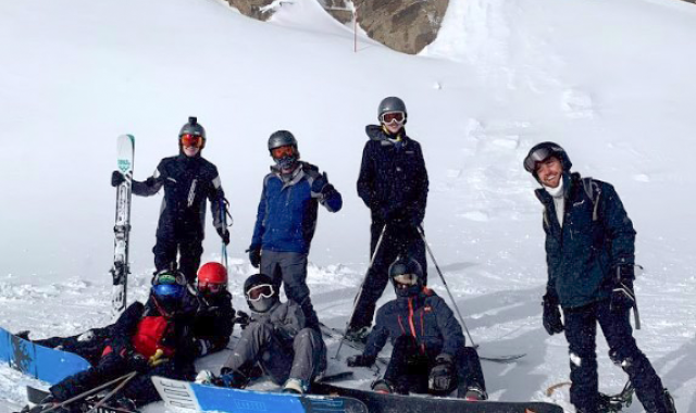 Club members posing among a lot of snow!